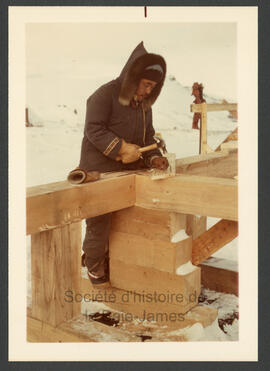 Inuit carpentry crews working on housing foundations