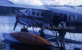 Pulling out, loading plane with equipment.