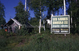 Sign and buildings “Les mines Chasm” on Windy Lake.