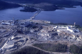 Merrill, Campbell Chibougamau Mines and open pit from air.