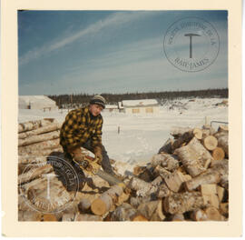 Jim Reid cutting firewood for H.B.C. house