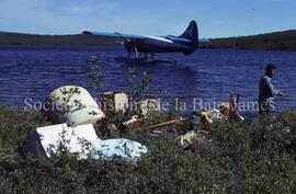 Plane going away all baggage on shore, Robert, Chibougamau Lake.