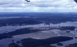 Campbell Chibougamau Mines tailings, point, mine and town in background.