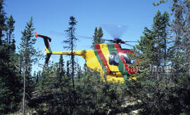 Helicopter on top of montain, Chibougamau forest.