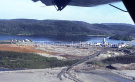 Air view Campbell Chibougamau Mines, point and tailings red and gray.