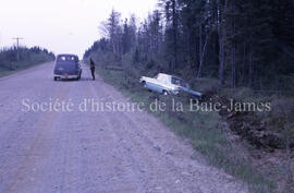 Road to Chibougamau, car in ditch.